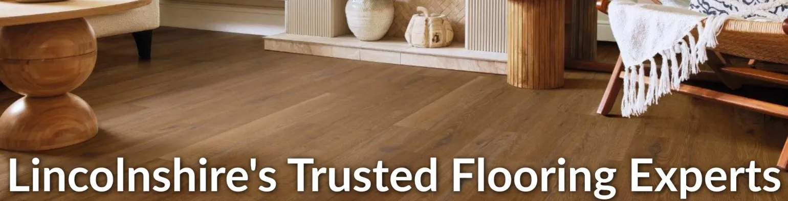 Wood-effect flooring in a contemporary living room from Downtown Stores' carpets and flooring department.