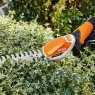 Stihl HSA26 Cordless Shrub Shear with shrubs