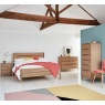 Ercol Rimini Oak 3 Drawer Bedside Cabinet - Lifestyle View